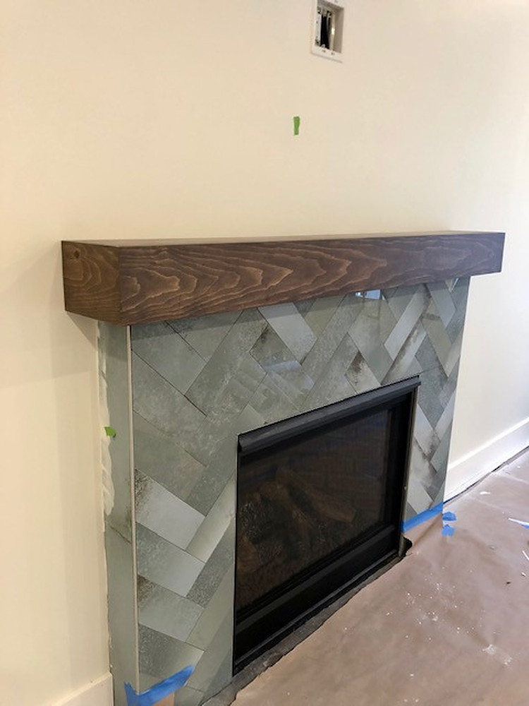 Tile fireplace and wood mantel