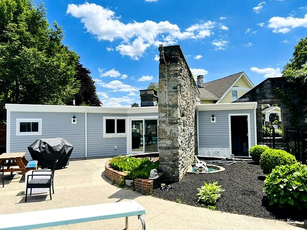 Custom home with stone chimney