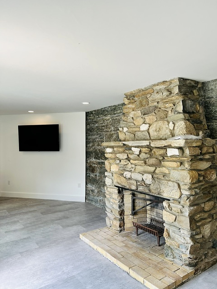 Floor-to-ceiling stone fireplace
